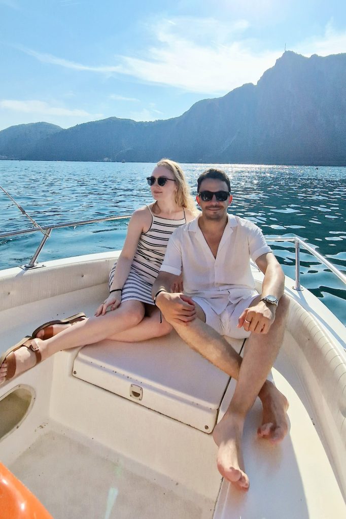Alber and Anastasia sitting together on a boat on Lake Lugano