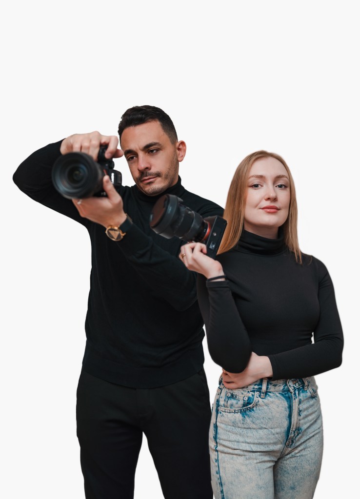 Alber and Anastasia are posing together with their cameras